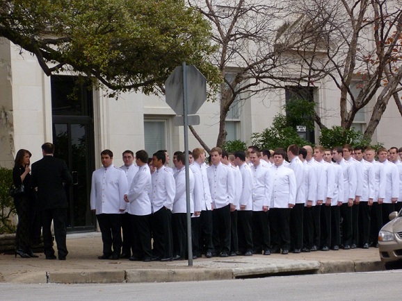 Waiters waiting in line for an outdoor celebration